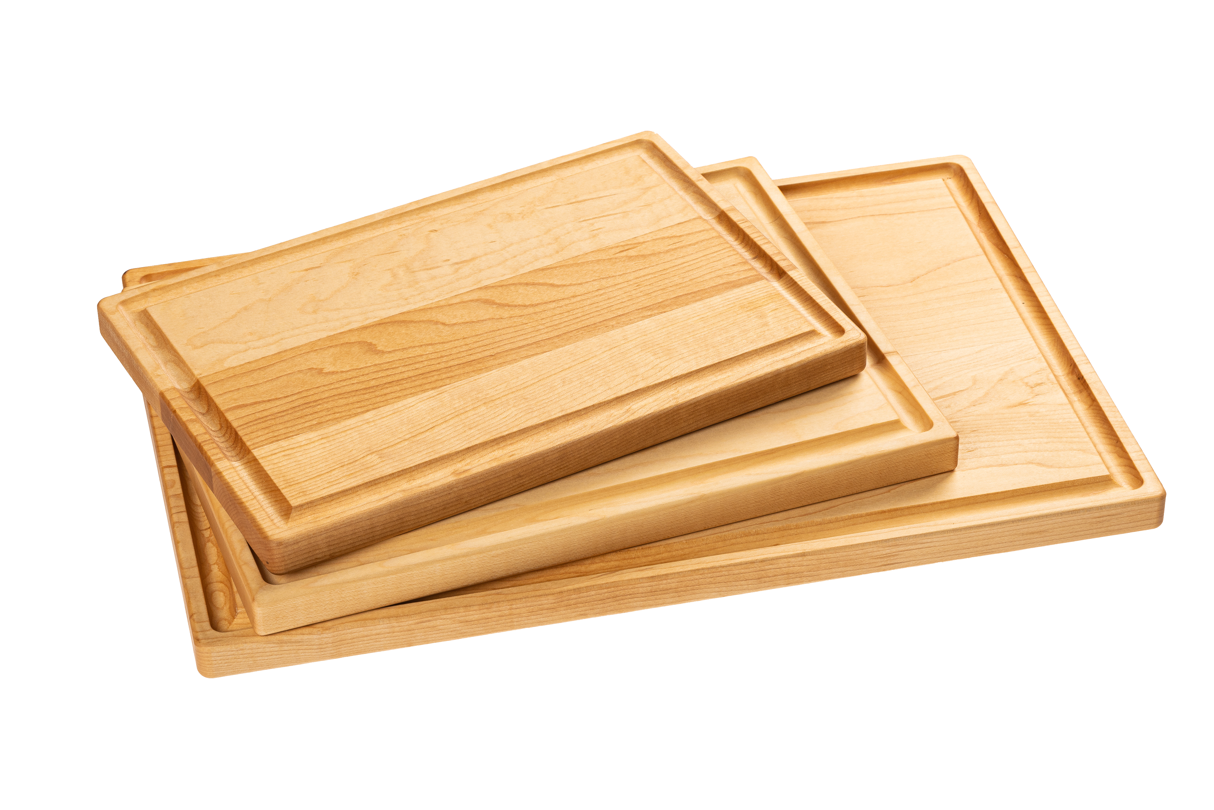 A set of three wooden cutting boards made from maple and cherry, stacked in descending size order.