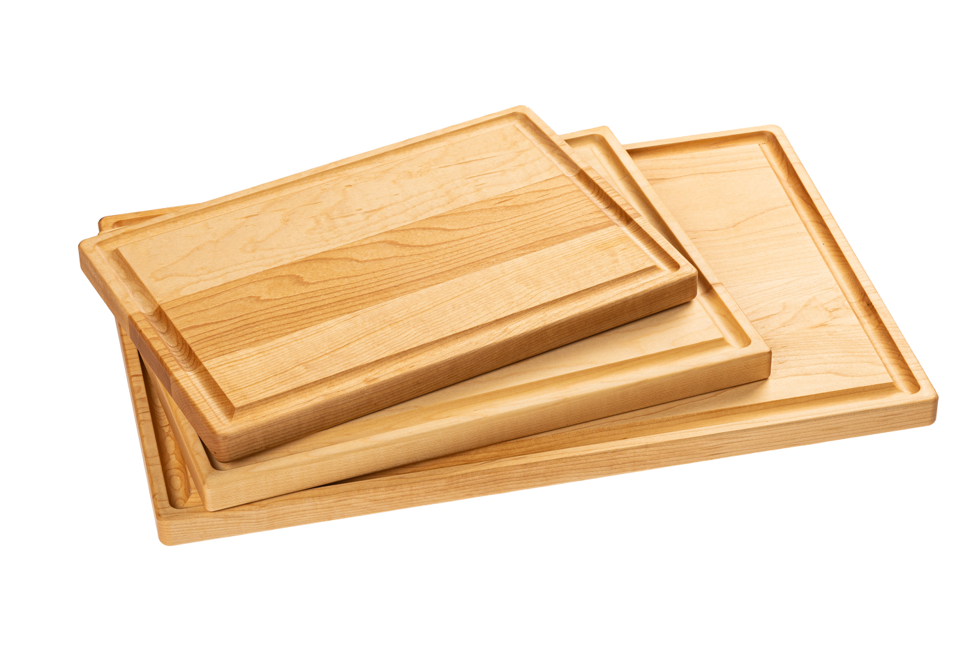 A set of three wooden cutting boards made from maple and cherry, stacked in descending size order.