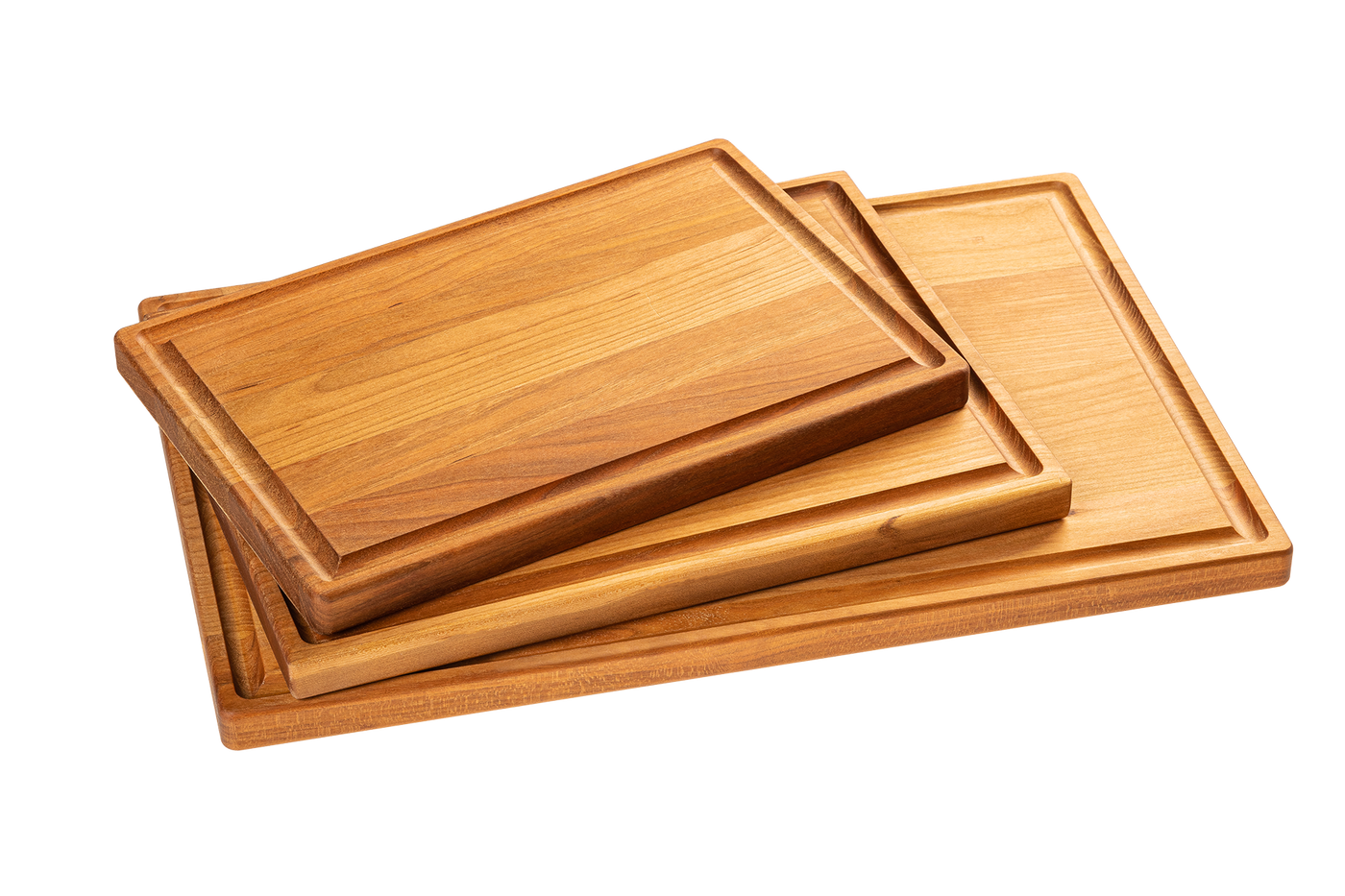 A set of three wooden cutting boards made from maple and cherry, stacked in descending size order.