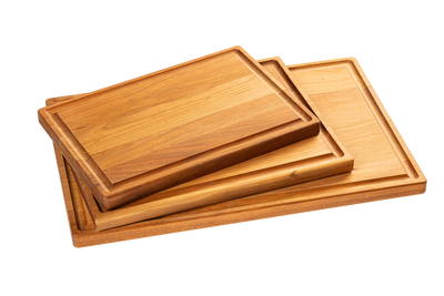 A set of three wooden cutting boards made from maple and cherry, stacked in descending size order.
