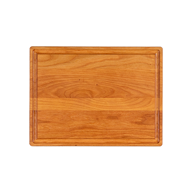 a reversible chop chop cherry wood cutting board with juice groove made in quebec made in canada