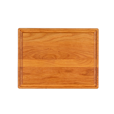 a reversible chop chop cherry wood cutting board with juice groove made in quebec made in canada