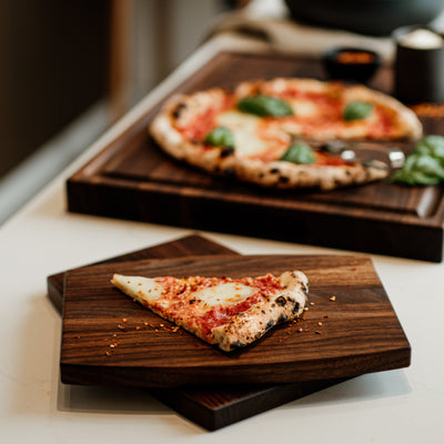 a set of 4 essentials chop chop walnut wood cutting boards with juice groove  made in quebec made in canada