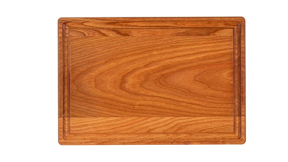 a reversible chop chop cherry wood cutting board with juice groove made in quebec made in canada