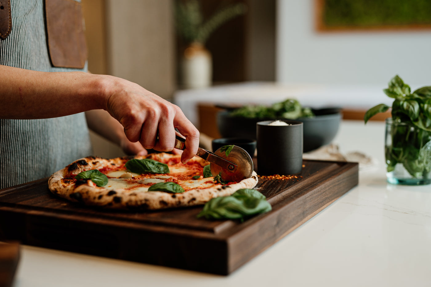 Chop Chop walnut wood cutting board with a deep juice groove, durable and elegant for kitchen prep and serving. Made in Quebec