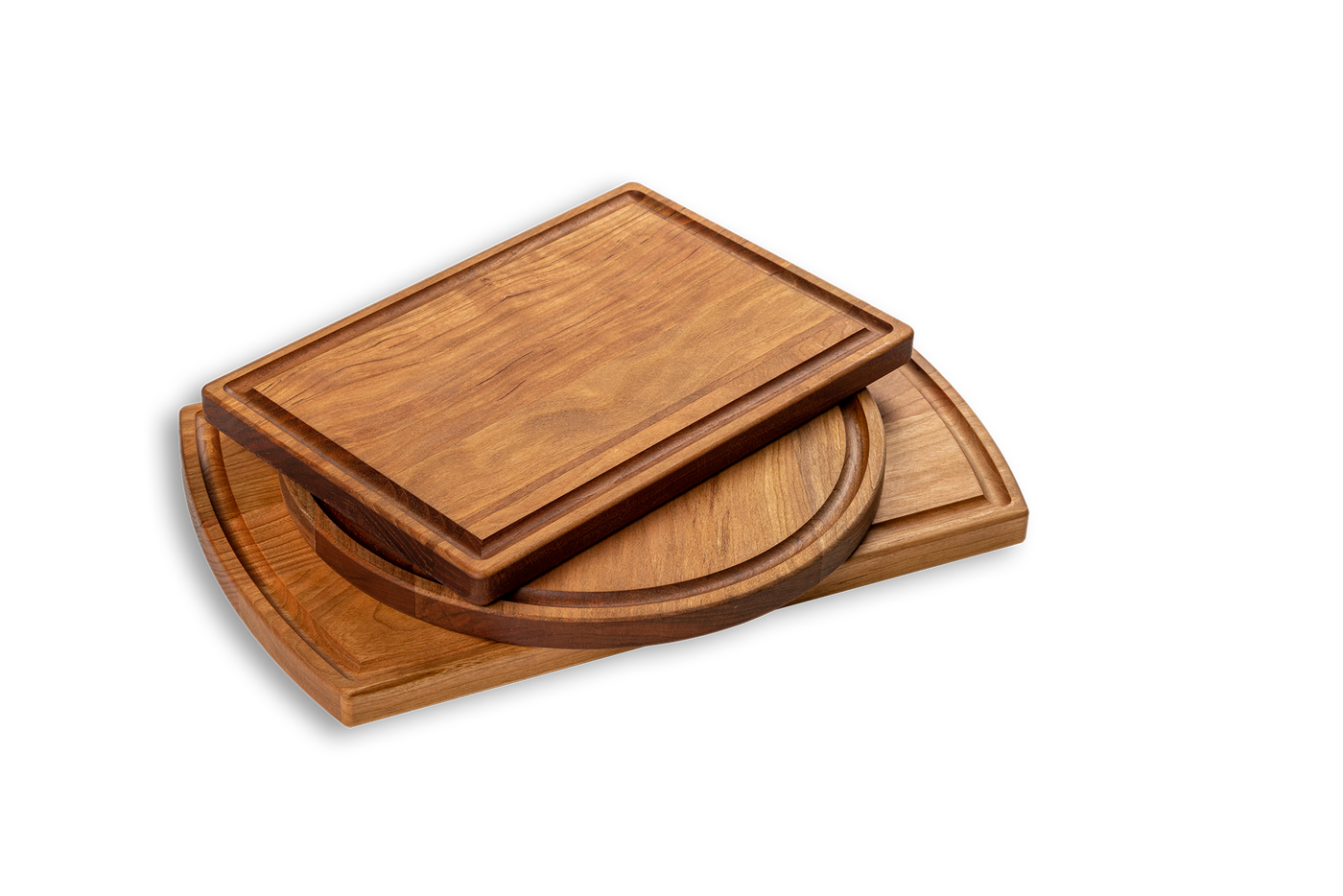 A set of three cherry wood cutting boards of different sizes. Made in quebec