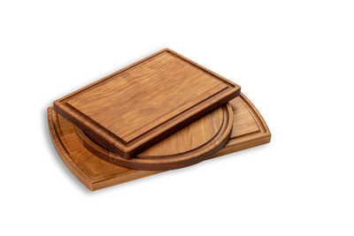 A set of three cherry wood cutting boards of different sizes. Made in quebec